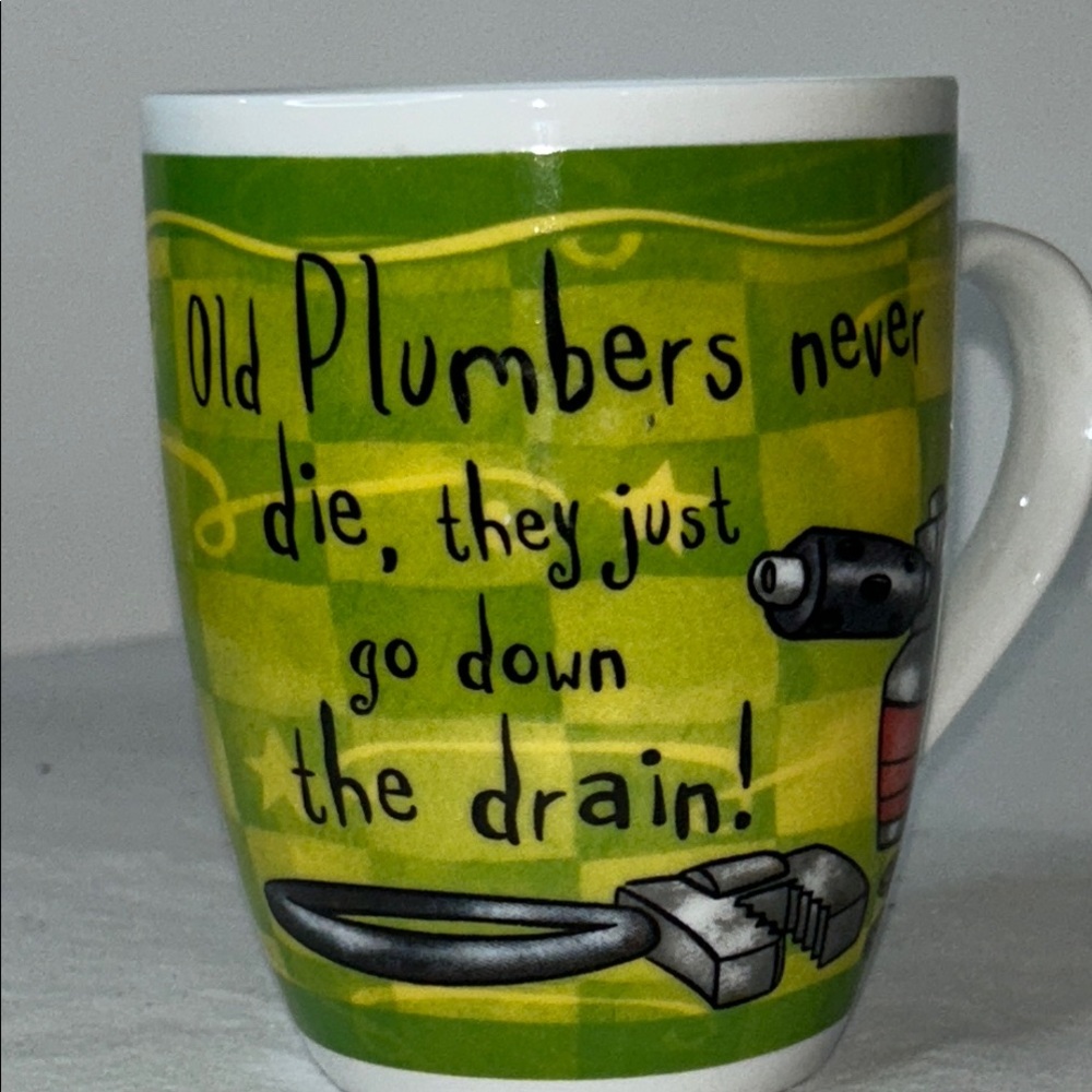 History and Heraldry Ceramic Mug with “Old Plumbers Never Die”….
